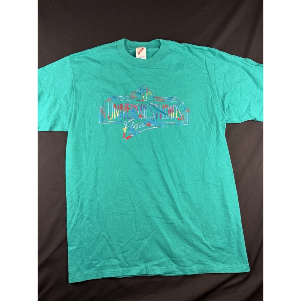 Vintage 90s Universal Studios Florida T Shirt Size L Teal Neon Marquee Jerzees